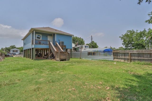 back of house with a lawn