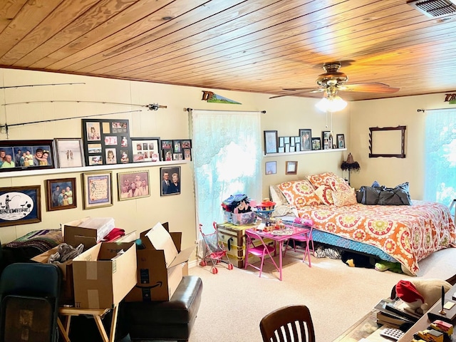 carpeted bedroom with ceiling fan and wood ceiling