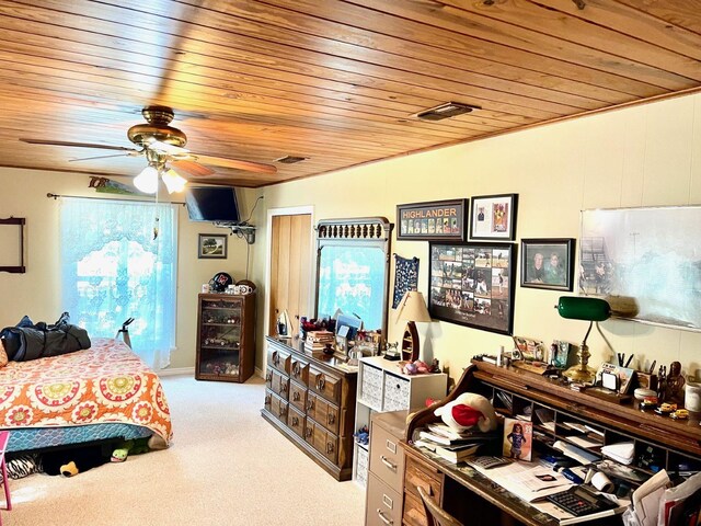 bedroom featuring ceiling fan, light colored carpet, and wood ceiling