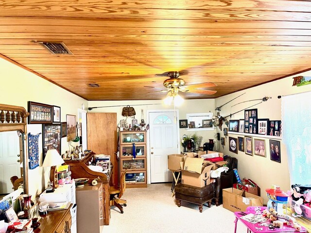 office space with carpet flooring, ceiling fan, and wood ceiling