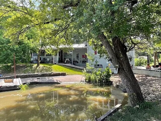 surrounding community featuring a water view