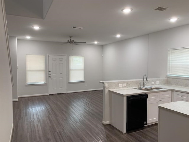 kitchen featuring dishwasher, dark wood-type flooring, white cabinets, sink, and ceiling fan