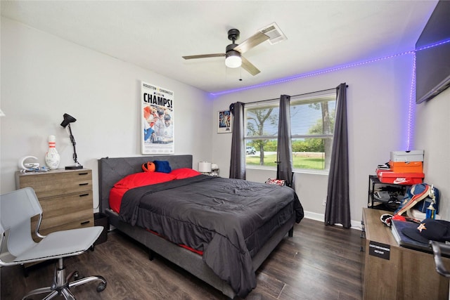 bedroom featuring ceiling fan and dark hardwood / wood-style floors