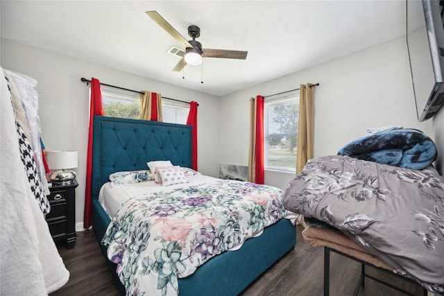 bedroom featuring ceiling fan and dark hardwood / wood-style floors