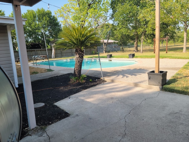 view of swimming pool featuring a patio