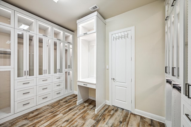 spacious closet featuring hardwood / wood-style flooring