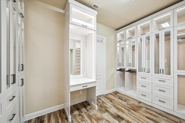 walk in closet featuring hardwood / wood-style floors