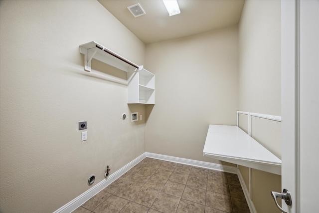 clothes washing area featuring gas dryer hookup, washer hookup, electric dryer hookup, and tile floors