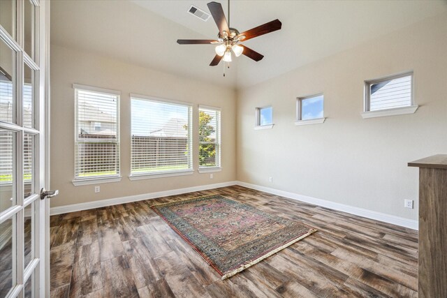 unfurnished room with ceiling fan and dark hardwood / wood-style floors