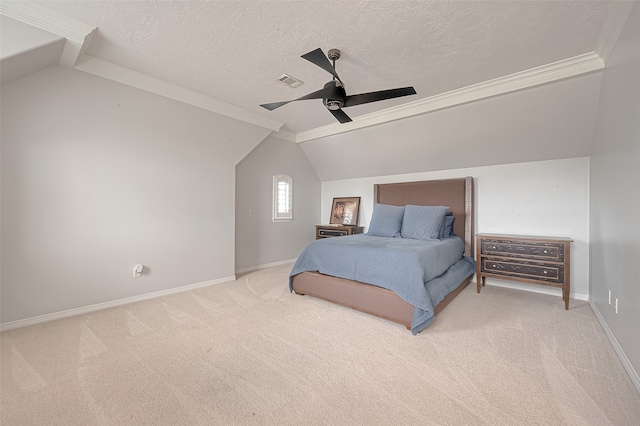 bedroom with ceiling fan, a textured ceiling, carpet flooring, and ornamental molding