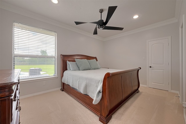 carpeted bedroom with ceiling fan and crown molding