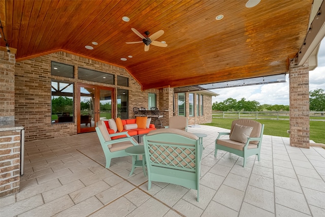 view of patio with outdoor lounge area and ceiling fan