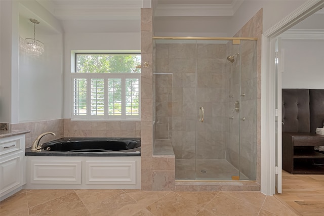 bathroom with tile floors, crown molding, and separate shower and tub