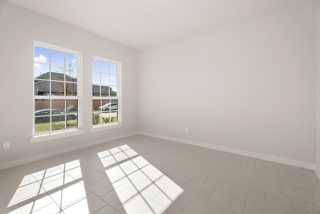 empty room with light tile patterned floors