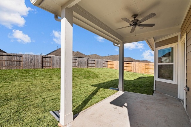 view of yard featuring a patio and ceiling fan