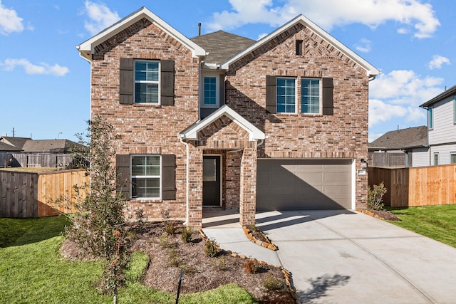 view of front of house featuring a garage and a front yard