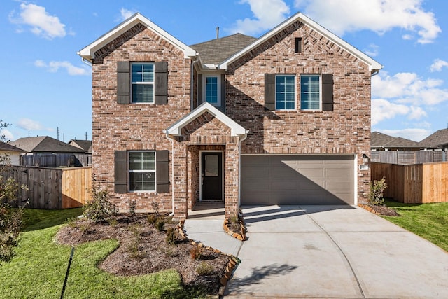 view of front facade featuring a garage and a front yard