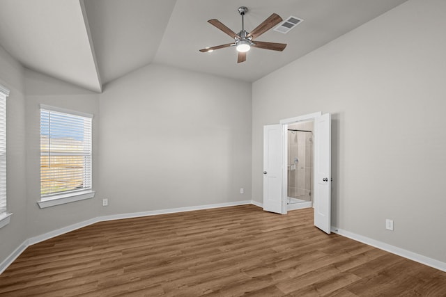 spare room with hardwood / wood-style flooring, ceiling fan, and vaulted ceiling