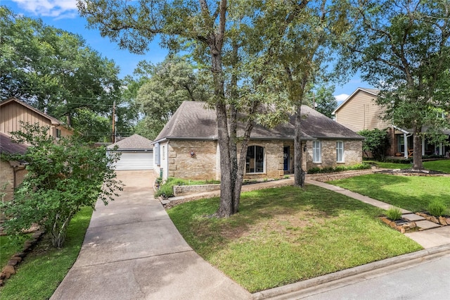 view of front of house with a front lawn and a garage