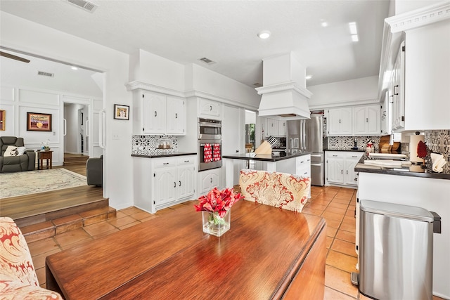 dining area featuring light tile patterned floors