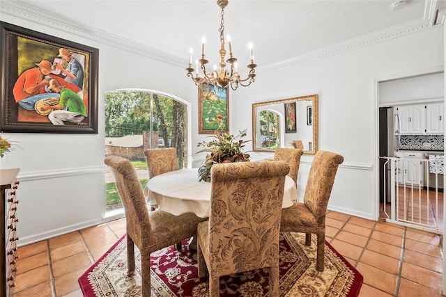 dining room featuring an inviting chandelier, light tile patterned flooring, and ornamental molding