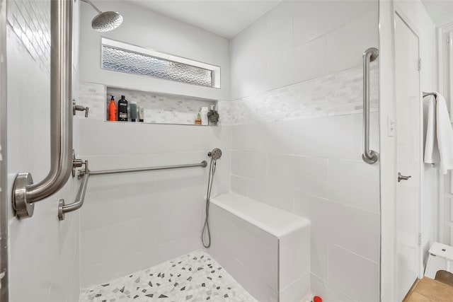 bathroom with tiled shower