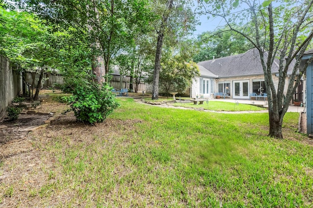 view of yard featuring french doors