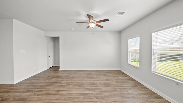 unfurnished room featuring ceiling fan and wood-type flooring