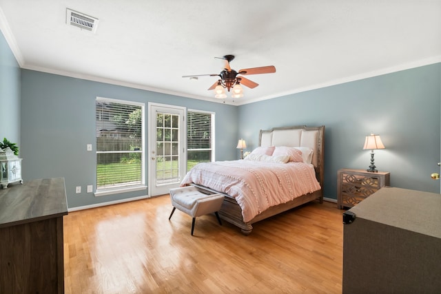 bedroom with wood-type flooring, ceiling fan, access to exterior, and crown molding