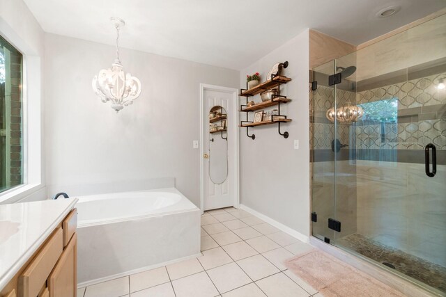 bathroom with tile flooring, separate shower and tub, vanity, and a chandelier