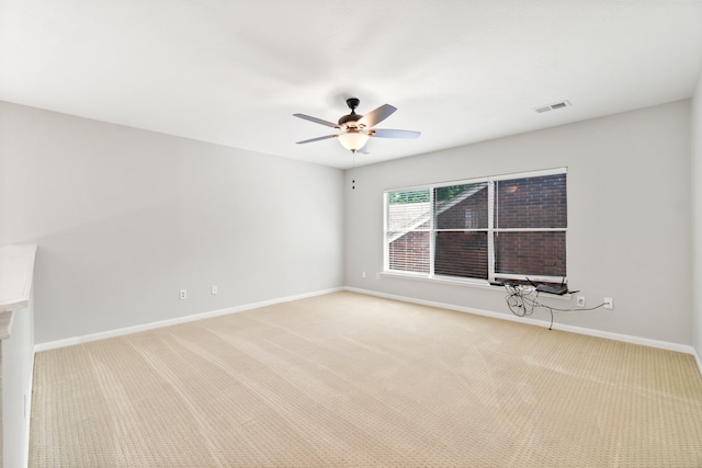 carpeted empty room with ceiling fan