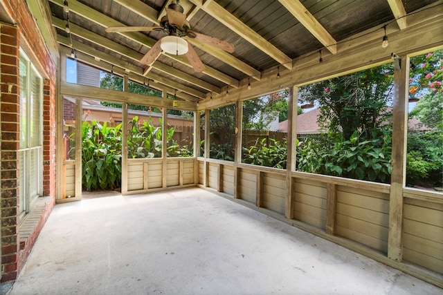 unfurnished sunroom with wooden ceiling, ceiling fan, and vaulted ceiling