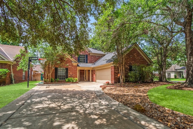 front facade featuring a garage and a front yard