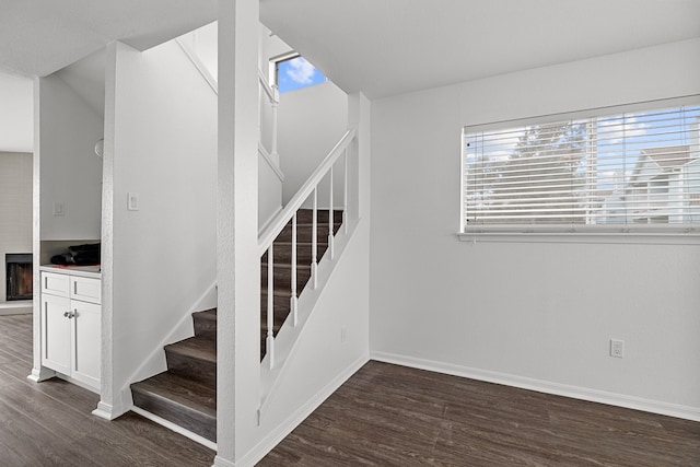 staircase with wood-type flooring