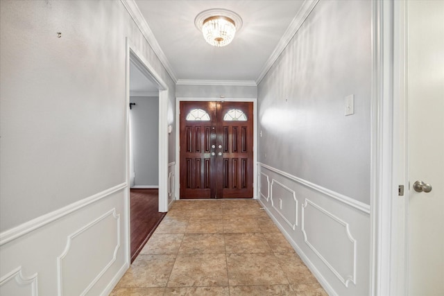 foyer entrance featuring ornamental molding