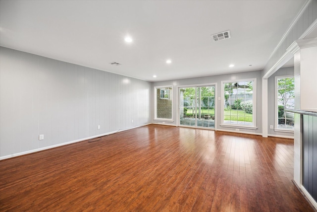 spare room featuring wood-type flooring