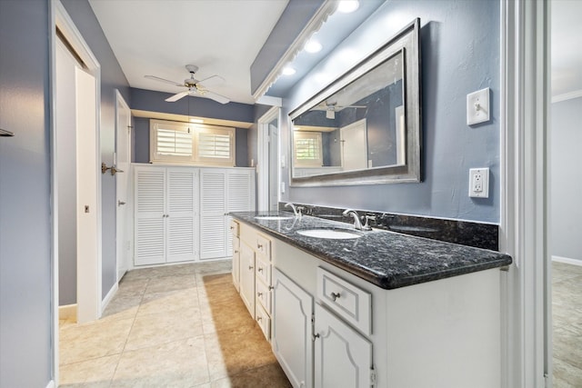 bathroom featuring ceiling fan, vanity, and tile patterned floors