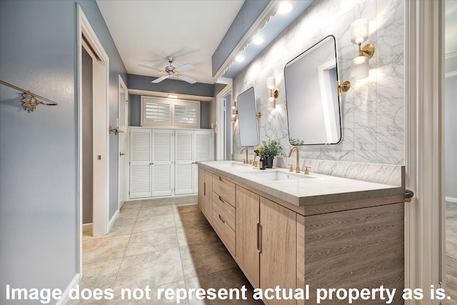 bathroom with ceiling fan, vanity, and tile patterned floors