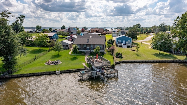 birds eye view of property with a water view