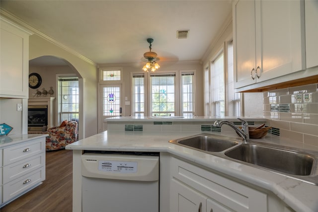 kitchen featuring white cabinetry, dishwasher, and sink