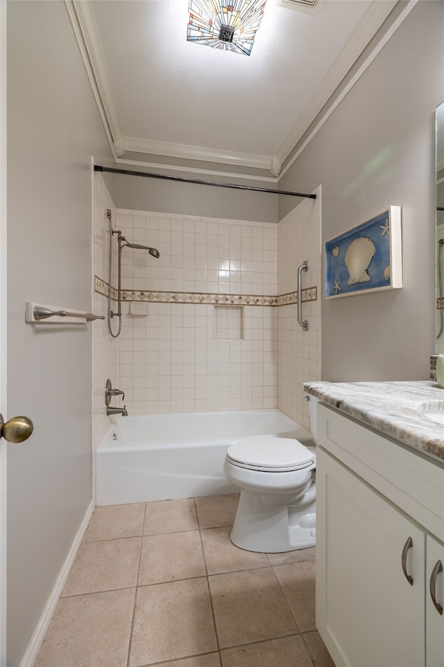 full bathroom with vanity, tile patterned floors, tiled shower / bath, toilet, and ornamental molding