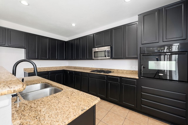 kitchen with black appliances, a sink, recessed lighting, light tile patterned flooring, and dark cabinets