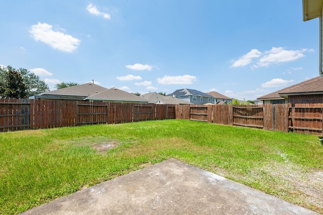 view of yard featuring a patio and a fenced backyard