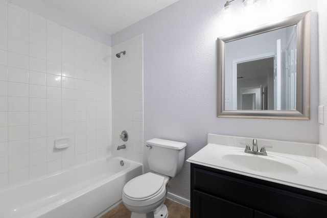 full bathroom with shower / bathtub combination, toilet, vanity, and a textured wall