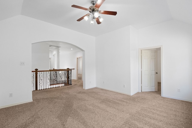 empty room featuring carpet, ceiling fan, and lofted ceiling