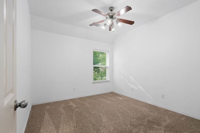 carpeted empty room featuring ceiling fan and lofted ceiling