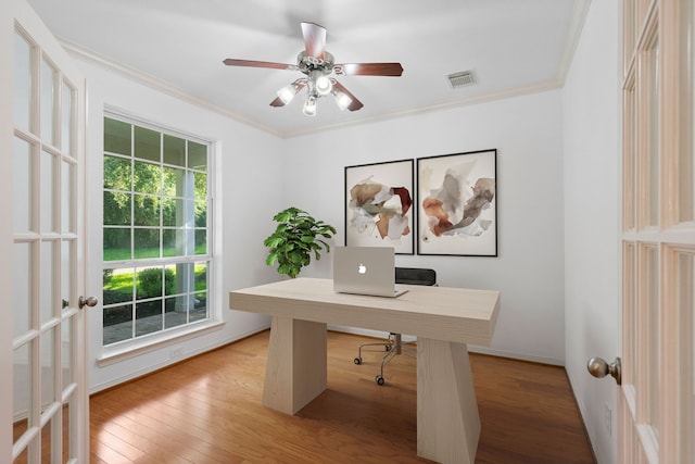 office area featuring crown molding, light hardwood / wood-style flooring, ceiling fan, and french doors