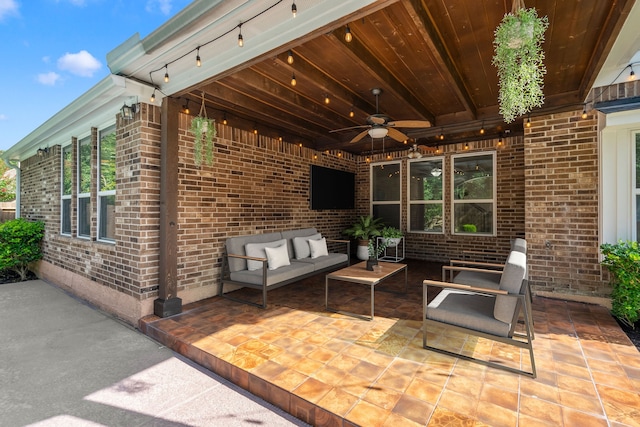 view of patio with outdoor lounge area and ceiling fan