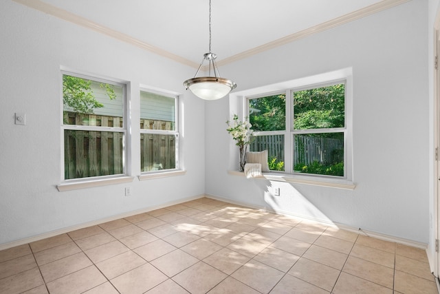 unfurnished dining area featuring light tile patterned floors and ornamental molding