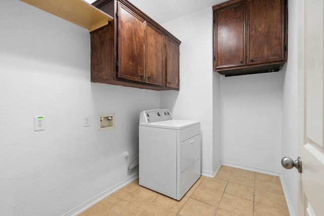 laundry room with cabinets, light tile patterned floors, and washer / clothes dryer